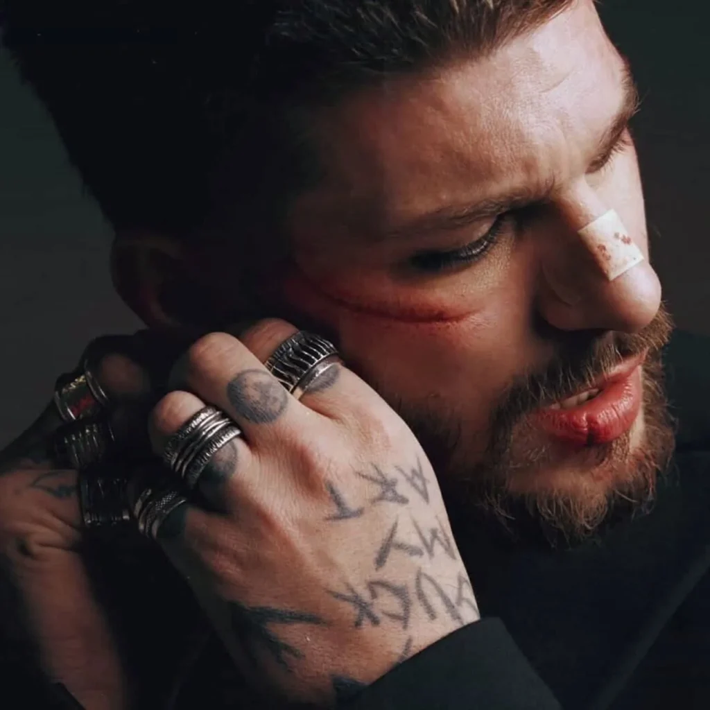 Man wearing heavy textured K.AND. rings in an editorial portrait